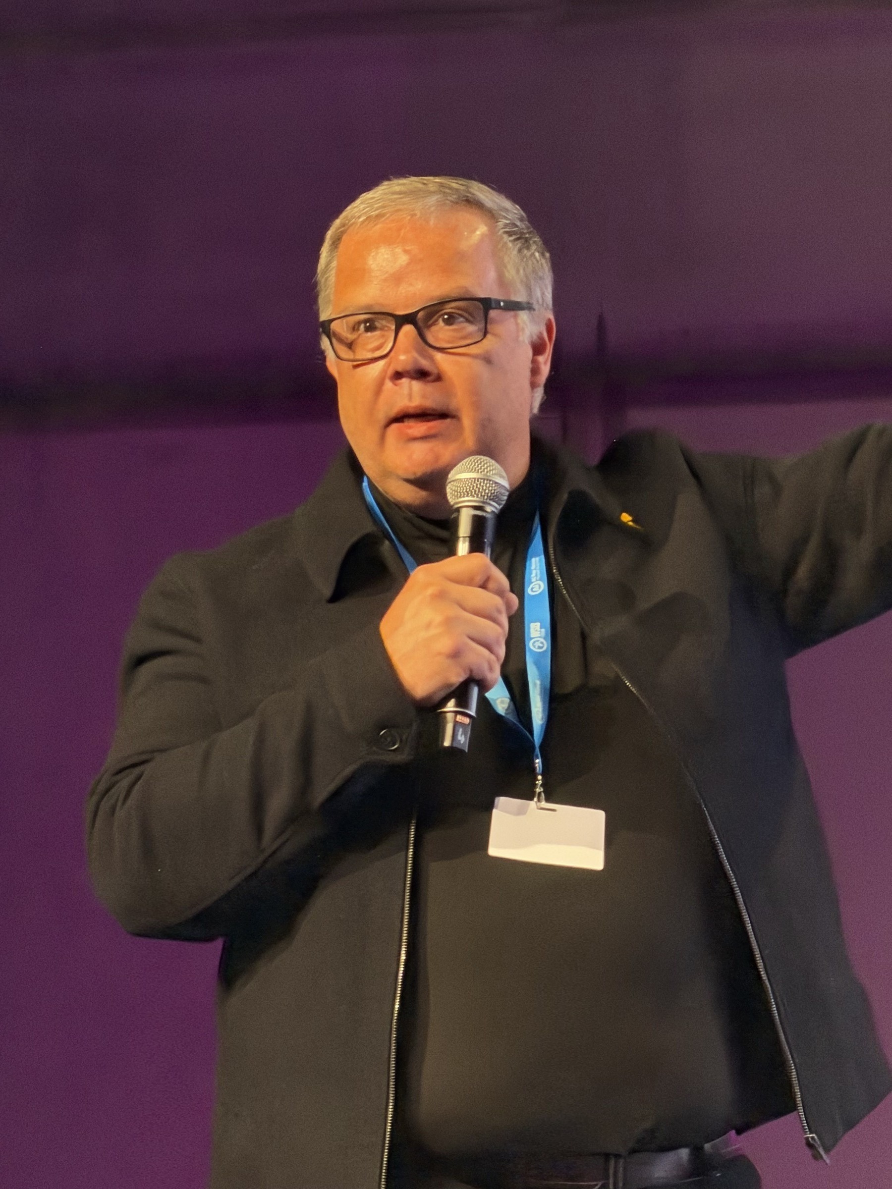 Gregory Renard portrait on stage at AI for Good, Geneva
