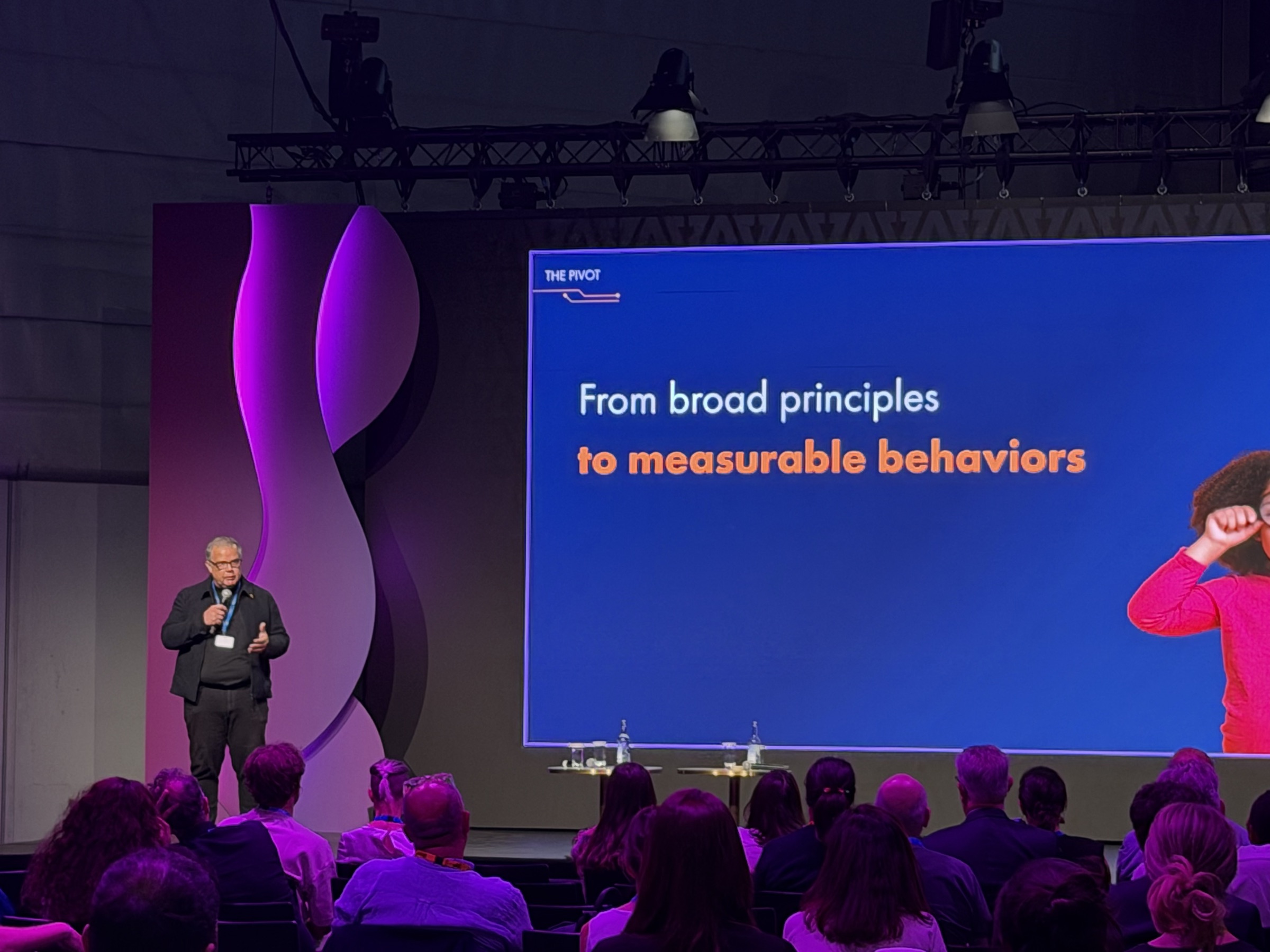 Gregory Renard presenting principles to a full room at AI for Good
